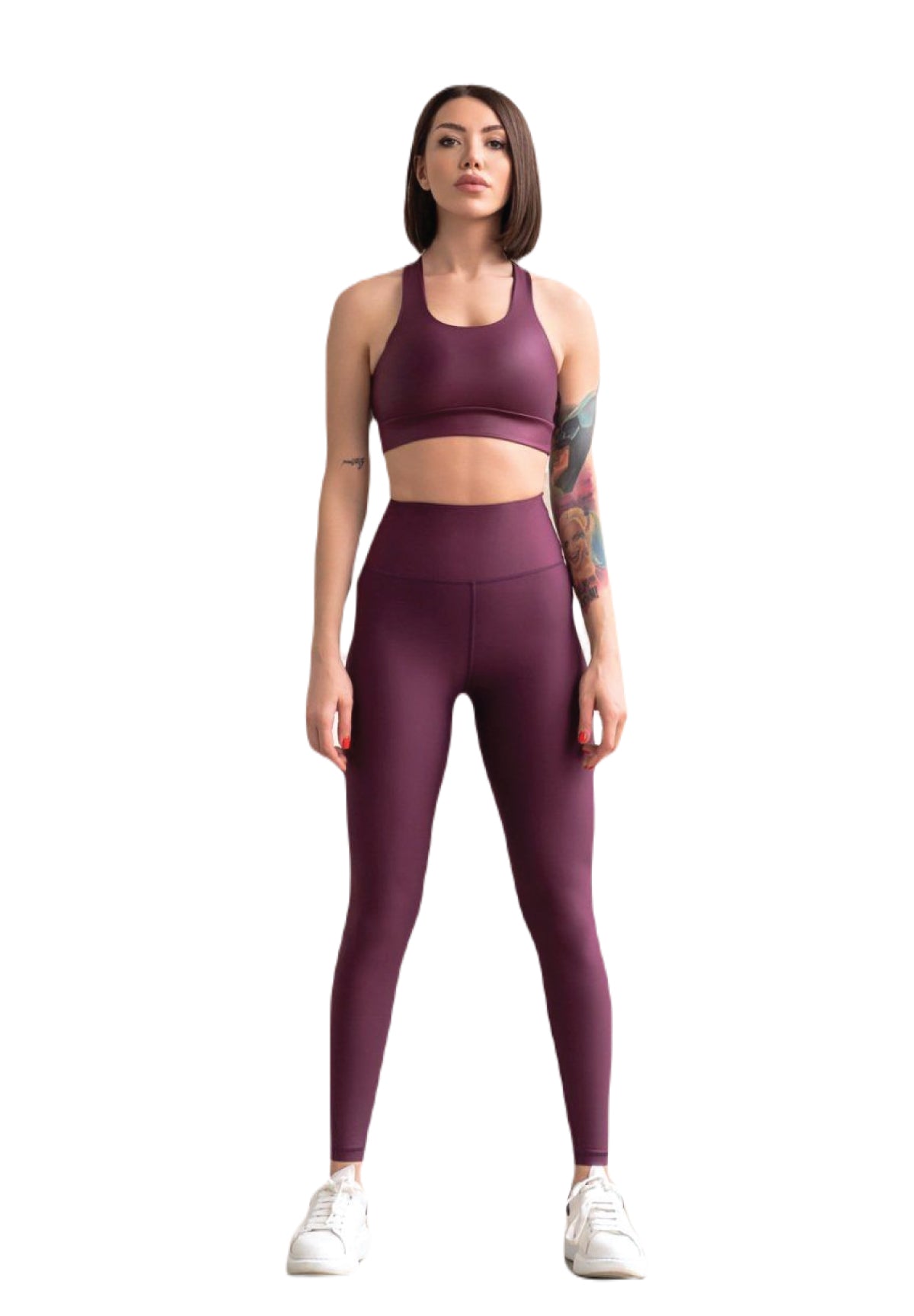 Sportliche Frau in Lisminas 255 High Waist Dunkelviolett Leggings und weißen Sneakers, neutral stehend.