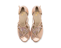 Draufsicht der Vela-Tanzschuhe von Dancing Queens in Gold mit rosa überkreuzten Riemen mit violetten Edelsteinen und Perlen.