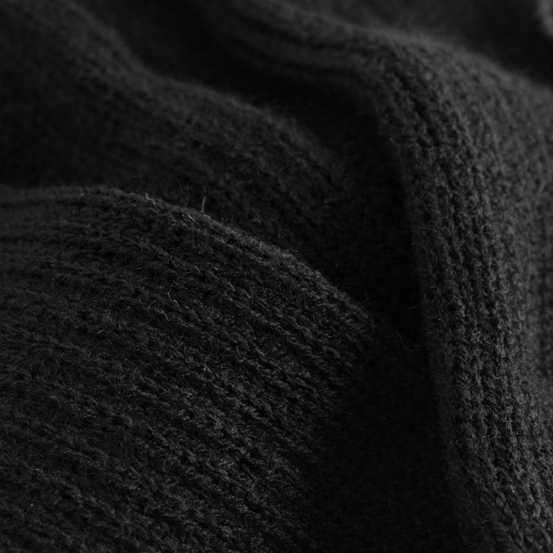 Nahaufnahme von Rumpfs 1120 Stulpen in Schwarz mit gerippter Textur, subtilen Falten und hervorragendem Wärmeschutz.