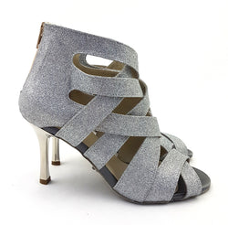 Dancing Queens S-G11 Shaula: silberne Glitzer-Ledersandalen mit hohen Absätzen.