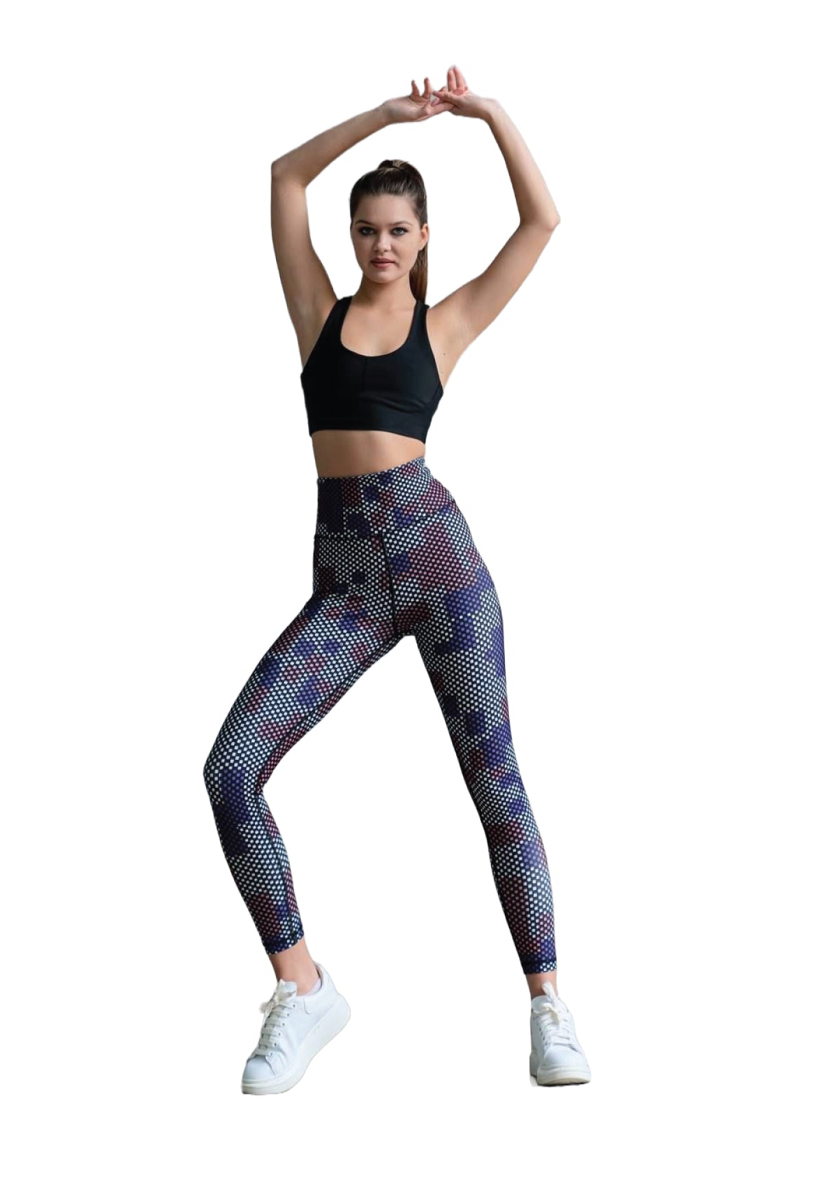 Sportliche Frau beim Dehnen, trägt einen schwarzen Sport-BH und die Braun Extra High Waist Polka Dot Leggings von Lismina.